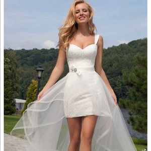 Brand new. Size 8 our white wedding dress.  Removable train.